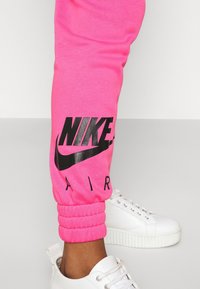 Nike Sportswear Träningsbyxor - pink