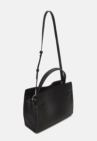 Black leather handbag with pebbled texture, featuring a short handle and an adjustable long strap, shown on a white background.