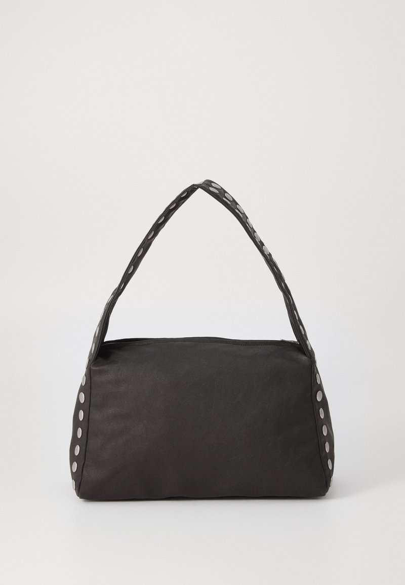 Black handbag with a rectangular shape, textured material, and a rounded handle featuring silver circular accents along the edges.