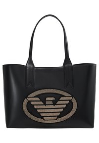 Czarna torba na ramię wykonana z gładkiej skóry, z dużym, ozdobnym logo orła z przodu. Dwa solidne uchwyty. Bezszwowy design.