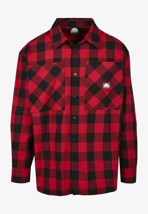 Piros és fekete kockás flaneling hosszú ujjal, gombos záródással, két elülső zsebbel, és egy kis márkalogóval a mellzsebén.