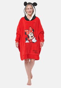 Poncho in pile rosso con orecchie nere sul cappuccio. Presenta una grande grafica di Minnie Mouse e una tasca, foderato in modo morbido e dettagli ricamati.