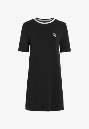 Schwarzes kurzärmeliges Kleid aus Baumwolle mit rundem Ausschnitt, das mit einem weißen Akzentstreifen und einem kleinen gestickten Design auf der Brust versehen ist.