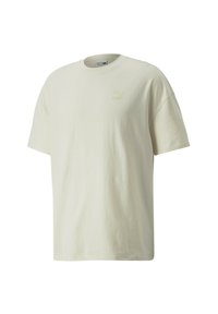 Cremefarvet bomulds t-shirt med klassisk rund halsudskæring, korte ærmer og et subtilt Puma-logo i en lysere nuance på brystet.