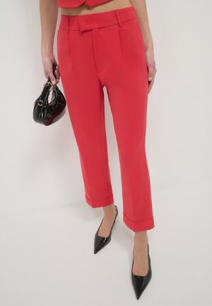 PANTALONE - Trousers - rosso