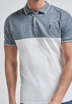 Blue and white color-blocked polo shirt, short sleeves, two buttons, textured fabric with contrasting collar and sleeve accents.