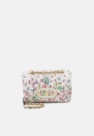 White quilted handbag with colorful floral and butterfly print, gold-tone chain strap, and rectangular gold clasp on front flap.