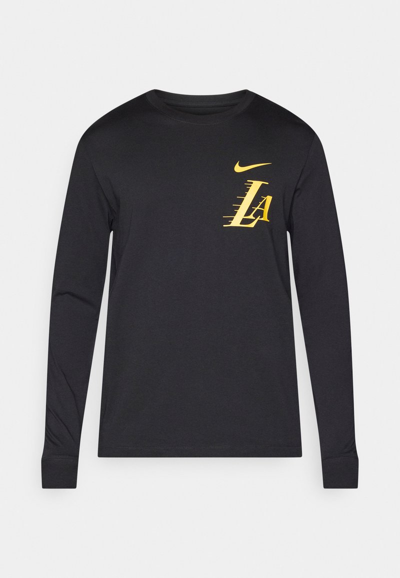 Camiseta de manga larga negra de Nike con un gráfico amarillo que presenta "LA" en la parte frontal, cuello redondo y mangas ajustadas. Material suave.