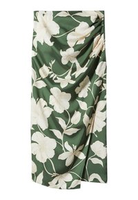 Jupe verte avec imprimé floral blanc et détails en tissu drapé sur un côté.