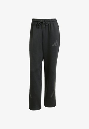 Sorte sweatpants lavet af blødt stof, med en elastisk talje og snoretræk samt en diskret logodetalje på siden.