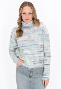 Gebreide coltrui met een multicolore gestreept patroon in pastelkleuren. Zachte textuur met geribbelde manchetten en een losse pasvorm.