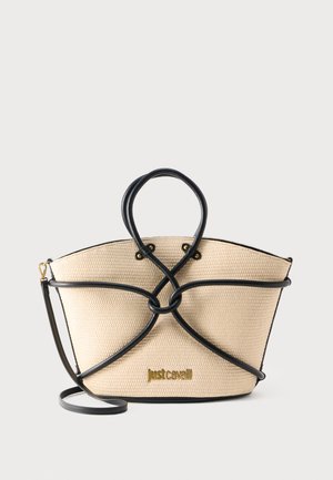 Sac fourre-tout tissé beige avec garniture et poignées en cuir noir, présentant un nœud décoratif et un logo doré "Just Cavalli" sur le devant.