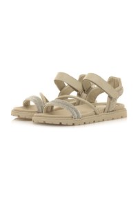Sandalias beige con correas cruzadas, una banda de strass texturizada y una suela de goma duradera con un diseño de dibujo estampado.
