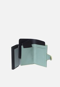 Mint green leather wallet with black accents, featuring multiple card slots, a snap closure, and a minimalistic design.