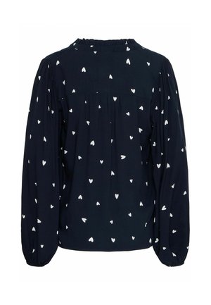 Blusa blu navy con motivo a cuori bianchi. Presenta maniche lunghe a sbuffo e colletto arricciato. Il tessuto morbido offre una vestibilità comoda.