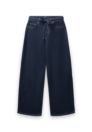Pantaloni in denim a gamba larga di colore blu scuro con vita regolabile. Presentano tasche frontali e cuciture a contrasto lungo le cuciture.