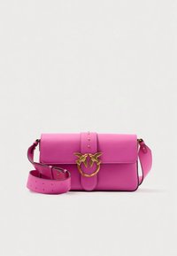 Pink leather handbag with a gold bird-shaped clasp, featuring a flat design, a detachable strap with perforations, and a smooth texture.