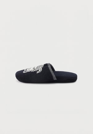 Single black slip-on slipper with white decorative tiger embroidery on top and gray trim around the opening, displayed on white background.