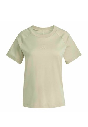 T-shirt beige clair à manches courtes et col rond avec un logo embossé subtil centré sur la poitrine, design simple et coupe régulière.