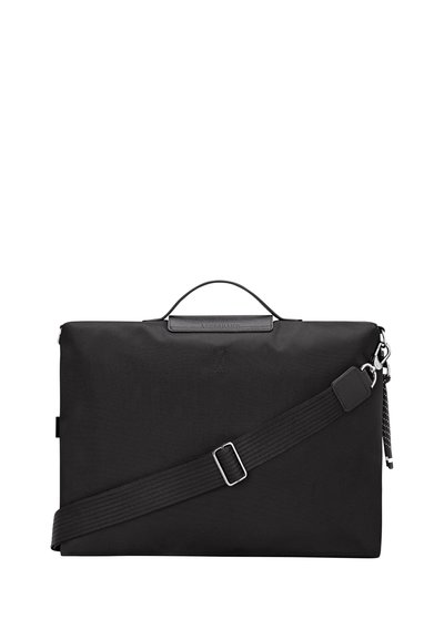 Black nylon bag with a sturdy handle, adjustable strap, and metal hardware. Features a sleek rectangular shape and a textured surface.
