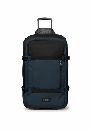 Maleta blanda con ruedas en negro y azul oscuro con bolsillo frontal con cremallera, asas para llevar y asa extensible.