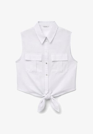 Sleeveless white button-up cropped shirt with collar, two front flap pockets, and a tied knot at the bottom center.