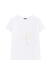 T-shirt en coton blanc avec un design en feuille d'or représentant une silhouette avec une jupe ronde et des accents floraux, à manches courtes et col rond.