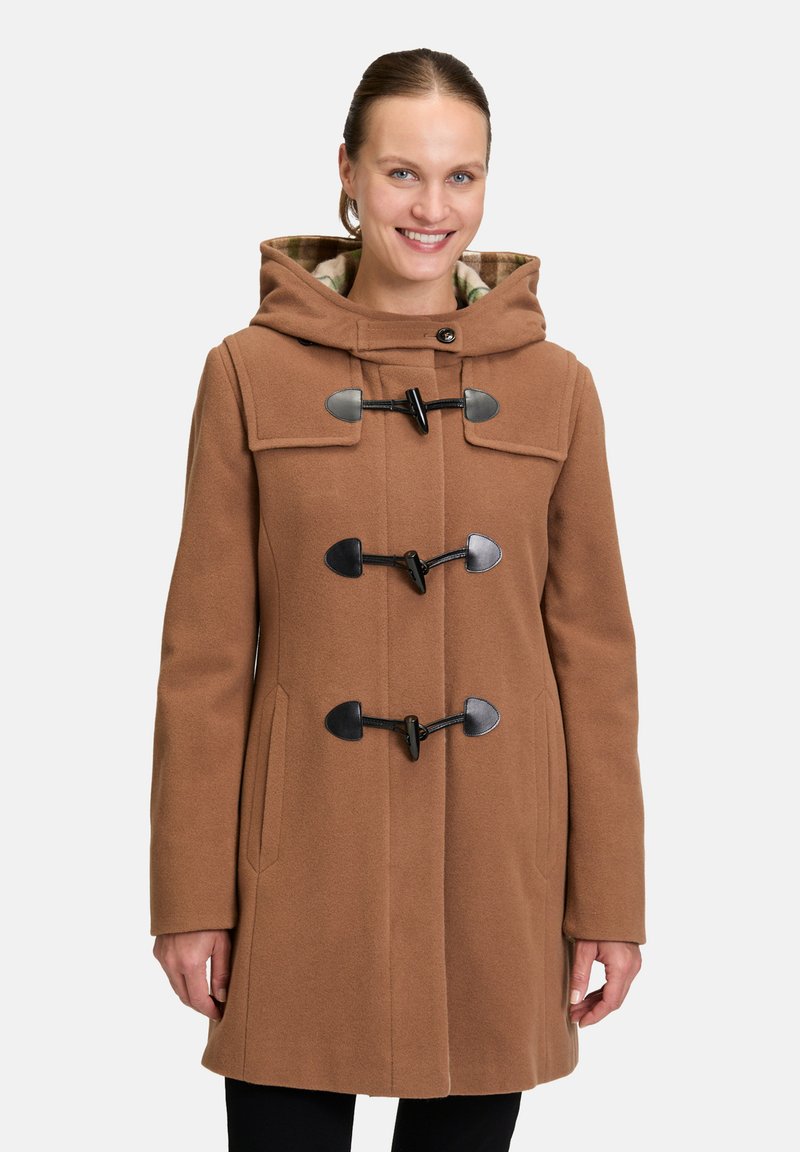 Bruine wolmix jas met een capuchon, voorzien van grote voorzakken en toggelsluitingen. Binnenkant gevoerd met een geruit patroon.
