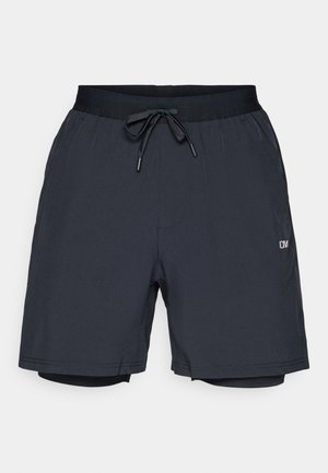Black athletic shorts with a drawstring waist, lightweight material, inner lining, and a small logo on the lower leg.