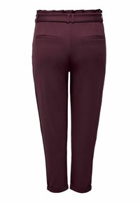 Burgundy trousers with a wide waistband, belt loops, and back pockets. Features a smooth texture and rolled hems. Tailored fit.
