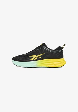 Czarny but do biegania z fakturowaną cholewką, żółtymi akcentami oraz gradientową podeszwą przechodzącą od żółtego do miętowej zieleni. Posiada wzmocnioną amortyzację.