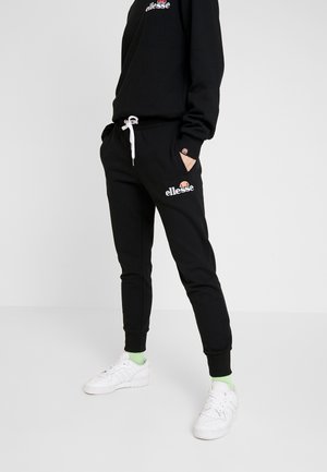 Zwarte sweatpants met een elastische tailleband en een trekkoord, met een logo op de linker bovenbeen. Geribbelde enkels. Gemaakt van een katoenmix.