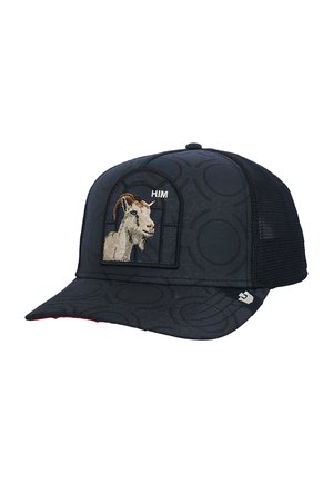 Gorra de béisbol negra de malla con patrón circular, parche bordado con cabeza de cabra y texto pequeño "HIM" en el panel frontal.