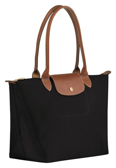 Black nylon tote bag with brown textured leather handles and accents. Features a flap closure with a logo and top zipper. Rectangular shape.