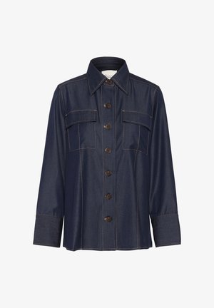 Tamsiai mėlynas džinsinis marškinis su ilgomis rankovėmis, mygtukų užsegimu priekyje, dviem krūtinės kišenėmis ir kontrastinėmis siūlėmis. Klasikinis apykaklė ir laisvas siluetas.