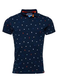Polo bleu marine à manches courtes avec petits motifs brodés multicolores et col à patte à deux boutons.