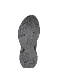 Black rubber sneaker sole with textured patterns, grooves, and dotted grip detailing. Features logo and angular design elements.