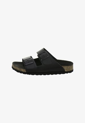 Black open-toe sandal with two adjustable buckled straps and a cork footbed with a textured black sole.