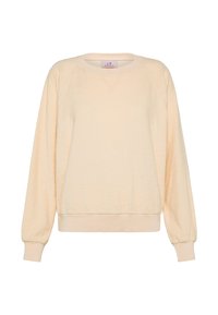 Kermanvärinen pitkähihainen collegepaita pyöreällä pääntiellä, resorit hihansuissa ja helmassa, pehmeä, teksturoitu kangas ja pieni tikattu yksityiskohta kauluksen alla.