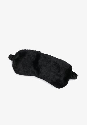 Masque de sommeil noir en velours, avec une texture en fausse fourrure douce et des sangles élastiques à chaque extrémité pour un ajustement sûr. Forme rectangulaire avec des bords arrondis.