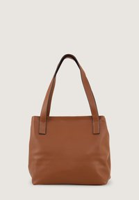 Brown leather tote bag with a textured surface, elongated handles, and minimalistic design. No visible patterns or hardware details.