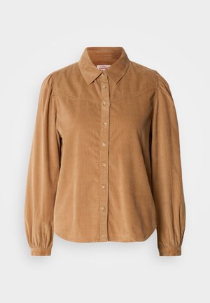 Camisa de pana marrón con cuello, mangas abullonadas de largo completo y cierre de botones, que presenta una tela texturizada y un dobladillo redondeado.