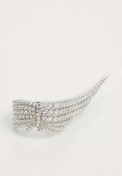 Silver hair clip featuring textured bands, embellished with clear rhinestones, curved design, and rounded ends for secure styling.