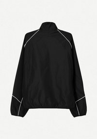 Zwarte windbreaker jas met witte biezen, opstaande kraag, lange mouwen en elastische manchetten en zoom. Lichtgewicht, gladde textuur.