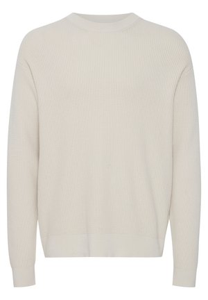 Pull de couleur crème avec un motif texturé en côtes. Présente des manches longues, un col rond et une coupe décontractée. Matière douce.