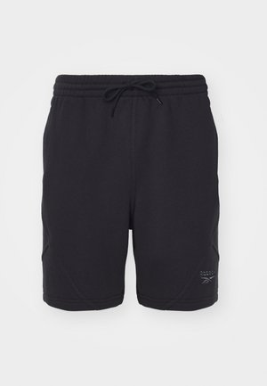 Sorte sportshorts med elastisk taljebånd og snøre, udstyret med flade syninger og et diskret præget logo på den nederste side.