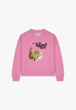 Sweatshirt rose avec un graphisme de lapin en train de dormir et le texte "ich hasse dich!" en lettres noires en gras. Design classique avec col rond.