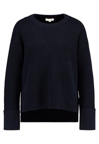Námořnický modrý pletený svetr s ribovanou strukturou, kulatým výstřihem a dlouhými rukávy s širokými manžetami. Mírně zkrácený střih s pohodlným střihem.
