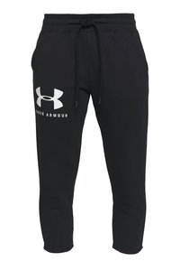 Schwarze Sweatpants mit elastischem Bund und Kordelzug, mit großem weißen Under Armour-Logo am linken Oberschenkel. Weicher Stoff, schmaler Schnitt.