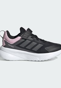 Black athletic shoe with a textured mesh upper, pink accents, adjustable strap, and a thick white rubber sole for comfort and support.